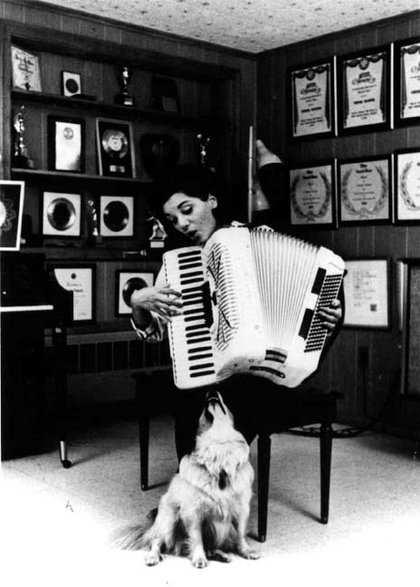 Connie entertaining her dog, Mambo