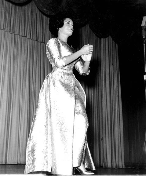 full length photo of Connie performing