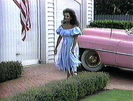 Connie in front of house