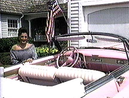 Connie in front of house