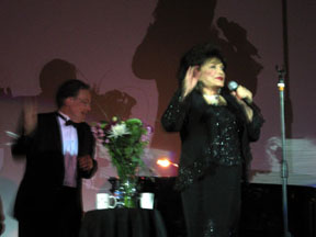 Connie on stage in black dress