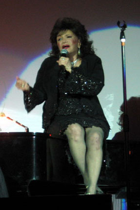 Connie on stage in black dress