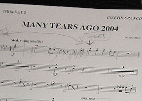 Sheet music with last minute notes for trumpet 2