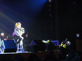 Connie on stage, cameraman (lower right) for large screen